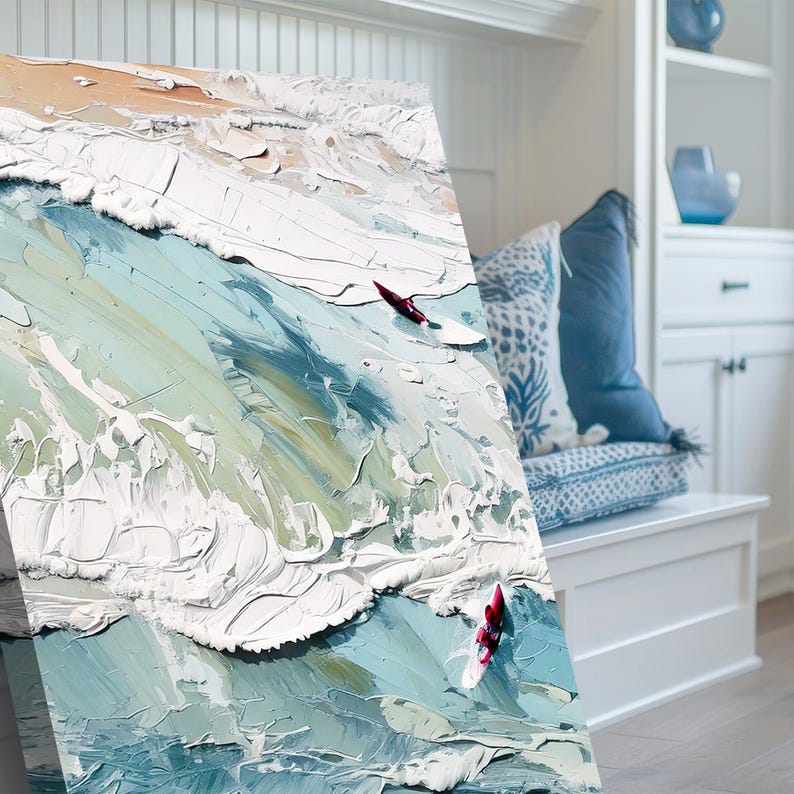 May include: Textured oil painting of ocean waves in shades of blue, white, and green. The artwork features a thick impasto technique, with visible brushstrokes creating a sense of movement. Two red surfboards are visible in the water.