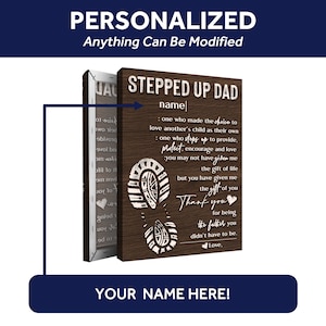 May include: A wooden sign with a brown background and white text. The sign reads "Stepped Up Dad" and includes a quote about the love and support a stepdad provides. The sign is decorated with a white footprint graphic.