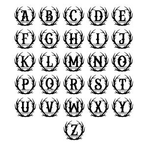 May include: A set of 26 black and white monogram letters, A through Z, in a wreath of antlers. Each letter is centred in the wreath.