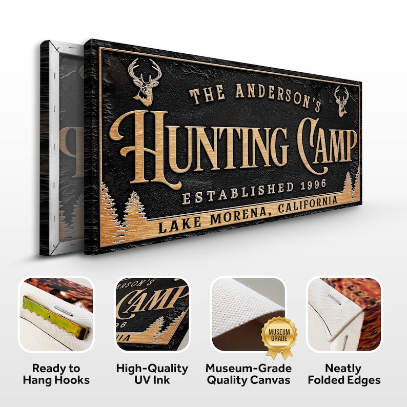 May include: A black and brown wooden sign with the text "The Anderson's Hunting Camp Established 1996 Lake Morena, California". The sign features a deer silhouette and a stylized font.