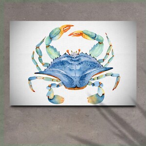 May include: A watercolor painting of a blue crab with orange and green claws. The crab is facing the viewer with its claws raised.