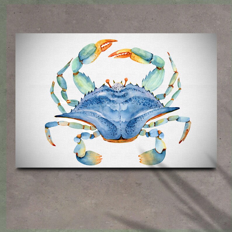 May include: A watercolor painting of a blue crab with orange and green claws. The crab is facing the viewer with its claws raised.