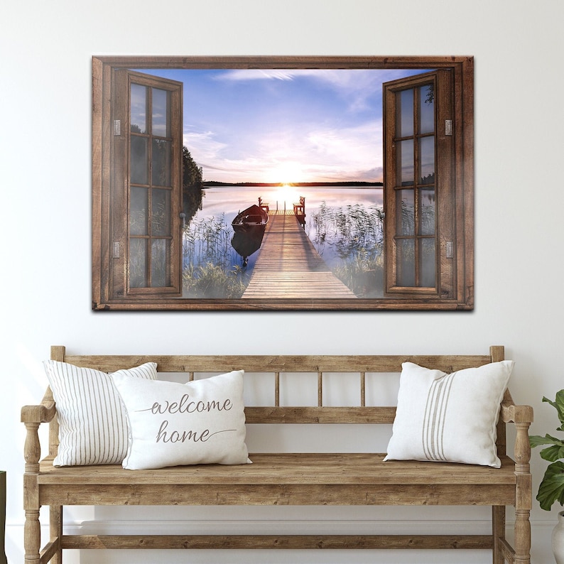 Lake Window Wall Art Home Print with the vintage-toned classic illusion of sunset with a docked boat on the lake scenery enclosed in an open window-inspired rustic canvas wall decor.