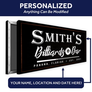 May include: A black and white sign with the text "SMITH'S Billiards & Bar" in a vintage style font. The sign also includes the text "PANAMA, FLORIDA I EST. 2021".