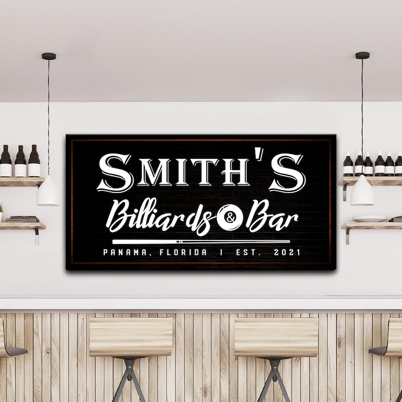 May include: Black and white sign with the text "SMITH'S Billiards & Bar" with a pool cue and billiard ball graphic. The sign also includes the text "PANAMA, FLORIDA | EST. 2021".