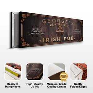 Puede incluir: Un letrero de madera con el texto "George's C&eacute;ad Mile F&aacute;ilte Irish Pub." El letrero tiene un fondo de madera marr&oacute;n con letras doradas y un dise&ntilde;o de tr&eacute;bol. El letrero est&aacute; listo para colgar con ganchos en la parte posterior.