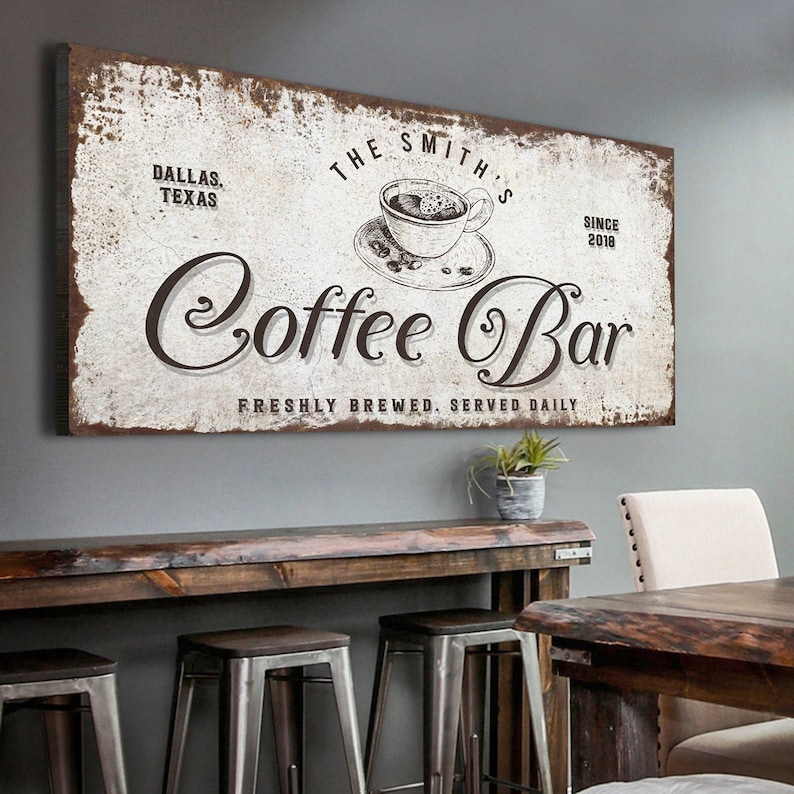 Coffee Bar Kitchen personalized home décor of a custom classic script with stenciled black coffee cup embellishments on a vintage white canvas and rustic brown frame.