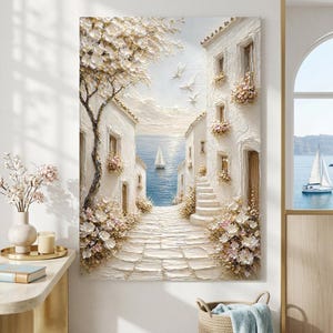 May include: A textured oil painting on canvas depicting a Mediterranean coastal scene with white stone buildings, a cobblestone path leading to a blue sea, a sailboat, a large flowering tree, and white birds flying in a soft, light-filled sky.