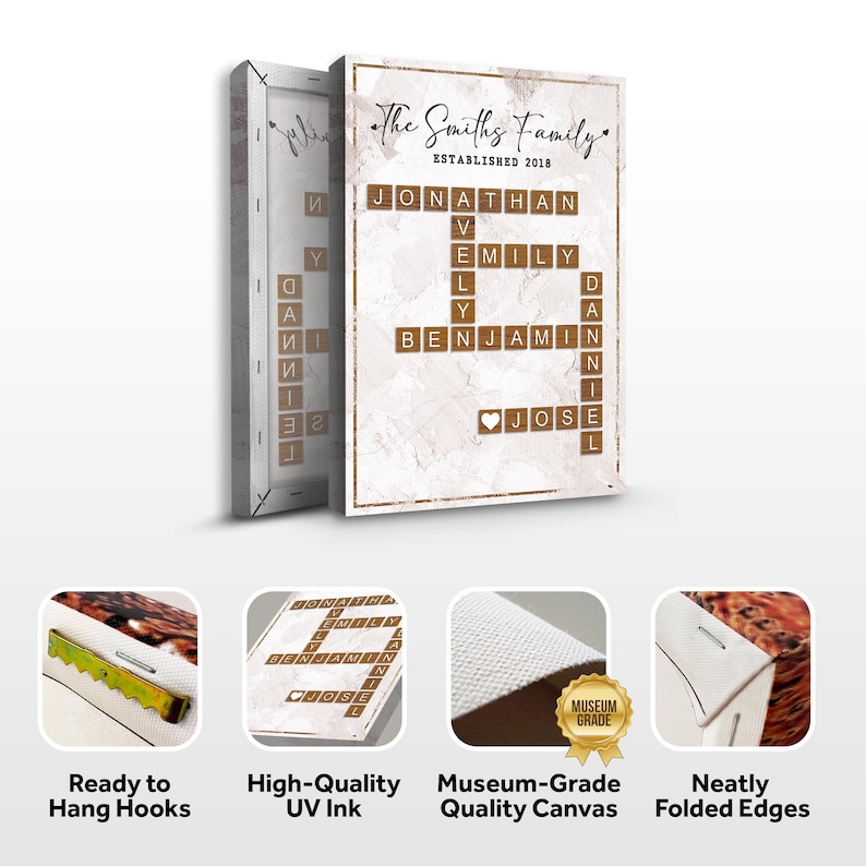 May include: A canvas print with a white marble background and a crossword puzzle featuring the names "Jonathan", "Emily", "Benjamin", and "Jose" in brown wooden letter tiles. The text "The Smiths Family Established 2018" is at the top of the print. The print has a gold frame and is ready to hang with hooks.