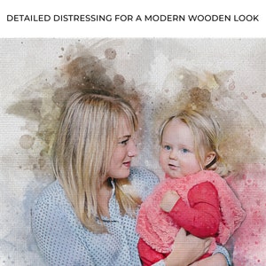 May include: A watercolor painting of a woman with blonde hair holding a young girl with blonde hair. The woman is wearing a light blue shirt with white polka dots. The girl is wearing a pink shirt and a pink sweater. The background is a light brown watercolor wash.