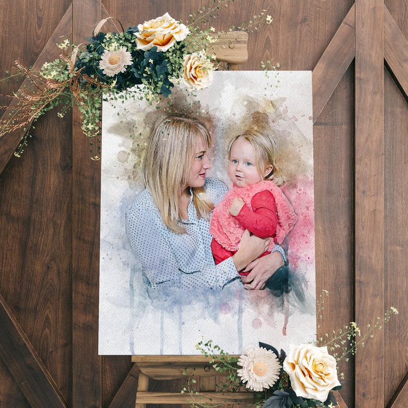 May include: A watercolor painting of a woman holding a young child. The woman is wearing a blue and white patterned shirt and the child is wearing a pink and red dress. The painting is on a white canvas.