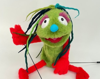 Green Melancholy with red accent - hand puppet, muppet style
