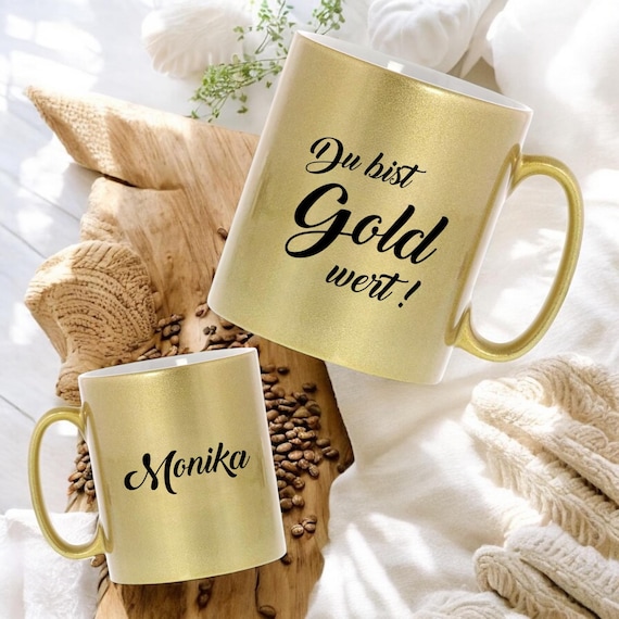 Goldene Keramiktasse mit Spruch 