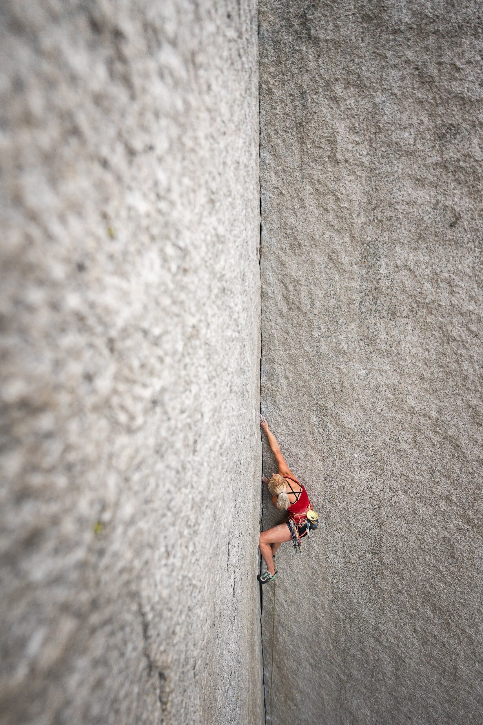 Climber (Brittany Goris) rock climbing the Shadow in Squamish, on the Chief, British Columbia