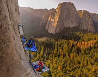 Couple sleeping on portaledges on the side of El Capitan, Yosemite Valley, California [photography wall print]
