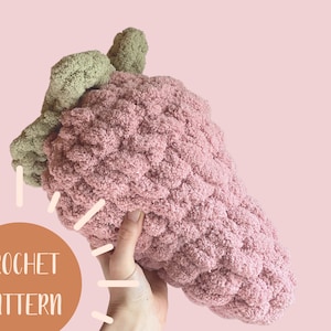 May include: A crochet pattern for a pink and green strawberry shaped plush toy. The pattern is available for download.