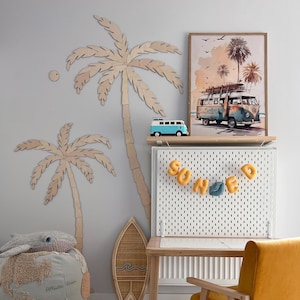May include: A coastal-themed room with a light blue and yellow color scheme. Features include a wooden palm tree wall decor, a framed print of a vintage van, and a yellow chair. The word "SOAKED" is spelled out with yellow letters.