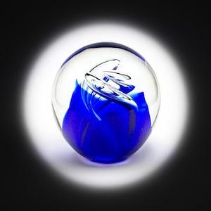 Scottish Vintage Glass Paperweight. Heavy transparent ball, blue abstract figure inside. Beautiful paperweight in perfect condition