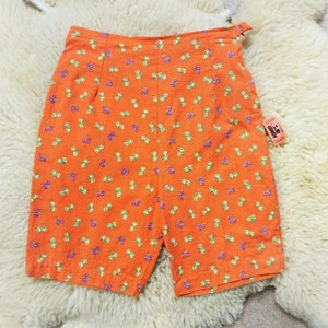 Vintage 1960s highwaisted long orange floral shorts