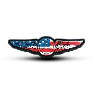 May include: A black and white patch with a red, white and blue American flag design. The patch features a circle with the text "A1C" and an anchor inside. The circle is surrounded by wings.