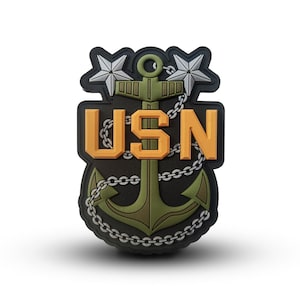 Può includere: Una toppa ricamata nera e verde con un'ancora dorata e le lettere USN. Due stelle argentate sono sopra l'ancora.