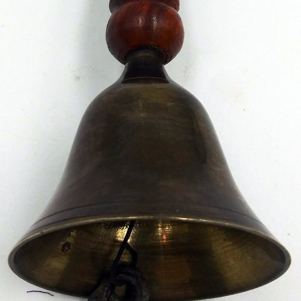 Carved  Brown Wooden Handle Brass Bell.  Carved knob at top and bottom of handle. Small etched brass bell at bottom. Metal dingier. Vintage.