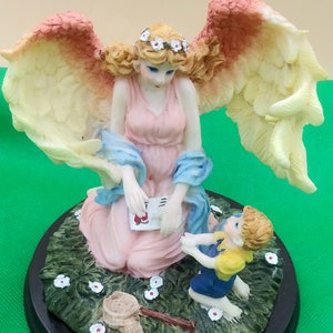Guardian Angel Figurine: Boy with Fishing Net, Pink Tipped Wings