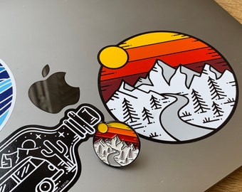 Mountain Sunset enamel pin badge and sticker combo, designed by Matt Carter