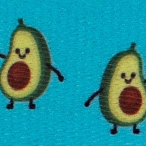 May include: Two cartoon avocados with smiling faces and brown pits on a blue background. The avocados have small arms and legs.