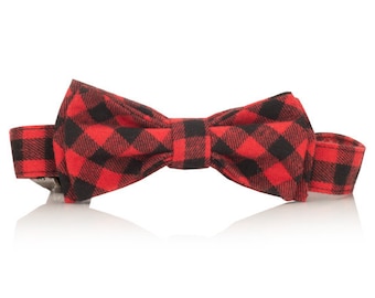 May include: A red and black plaid bow tie with an adjustable strap.