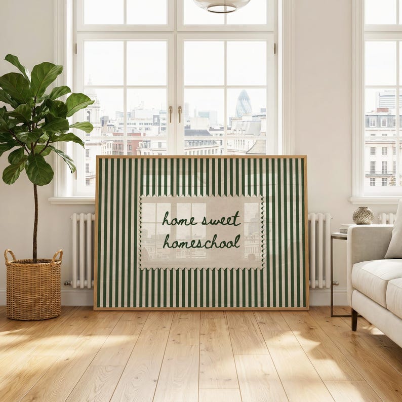 Framed artwork with green stripes and "home sweet homeschool" text on a stamped background.