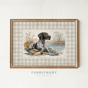 May include: Framed art print featuring a hunting dog and a duck by a body of water. The dog is black and white, and the duck has green and brown feathers. The print is set against a checkered background and framed in gold. The text "FABOLYNART ART PRINTS" is at the bottom.