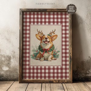 May include: A framed print of a smiling corgi adorned with a Christmas wreath and antlers with bells. The artwork is set against a red and white gingham background. The frame is dark brown. The words "Instant Digital Download" are in a circle in the upper right corner.