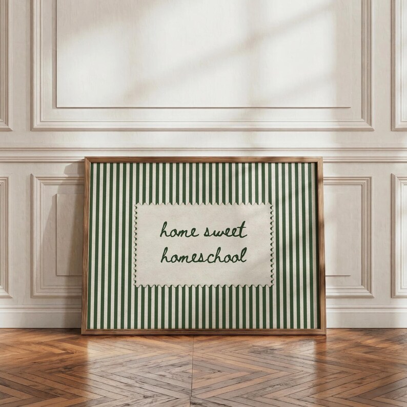 Framed artwork with green and white stripes reads "home sweet homeschool."