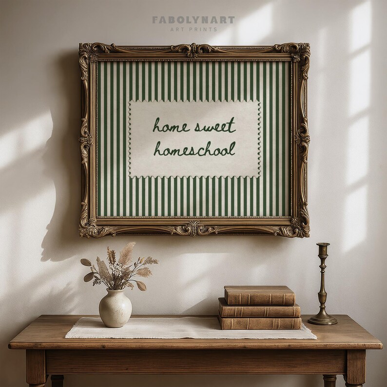 Framed artwork with green stripes and "home sweet homeschool" text.