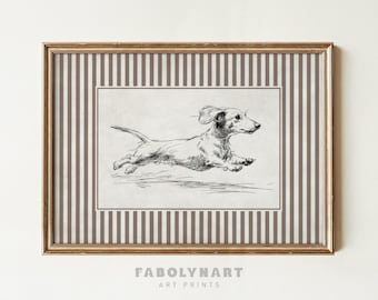 May include: A framed art print featuring a running dachshund dog illustration in black and white. The artwork is set against a striped background in shades of brown and white, with a gold-colored frame. The text "FABOLYNART ART PRINTS" is at the bottom.