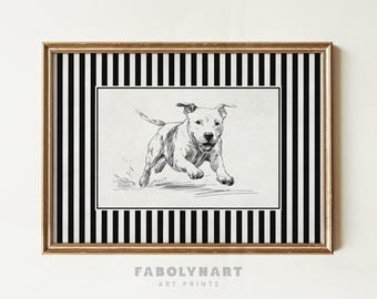 May include: A framed art print featuring a sketch of a running dog. The artwork is in black and white, set against a black and white striped background, and framed in gold. The text "FABOLYNART ART PRINTS" is at the bottom.