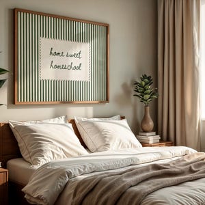 Framed art reading "home sweet homeschool" above a neatly made bed.