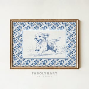 May include: A framed art print featuring a blue and white illustration of a happy dog running. The artwork is set against a blue floral patterned background and framed in gold. The text "FABOLYNART ART PRINTS" is at the bottom.