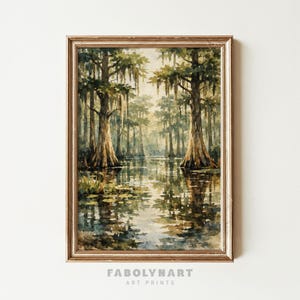 May include: A framed watercolor print of a swamp scene. The artwork depicts tall trees with Spanish moss hanging from their branches, reflected in the still water. The color palette includes greens, browns, and muted yellows. The text "FABOLYNART ART PRINTS" is at the bottom.