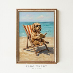 May include: A framed art print depicts a dog wearing sunglasses, reading a book while relaxing in a beach chair. The chair has orange and white stripes, set against a beach and ocean backdrop. The artwork is signed "FABOLYNART ART PRINTS".