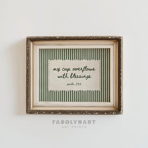 Framed artwork with scripture "my cup overflows with blessings psalm 23:5".