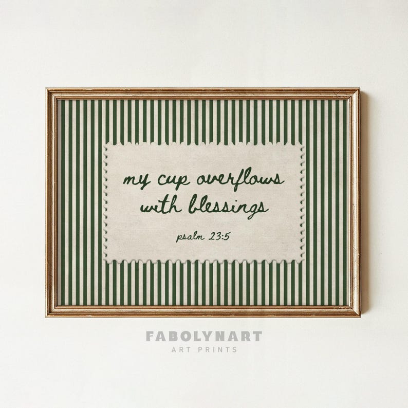 Framed art print with green and white stripes and text "my cup overflows with blessings psalm 23:5".