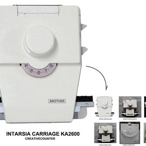 May include: A white Brother Intarsia Carriage KA2600 knitting machine accessory featuring a central circular dial with numbers four through eight in a light purple color. The device includes black brushes on the sides and text reading BROTHER.