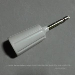 May include: A white plastic Brother Grip Assembly Swing Handle with a silver metal shaft. The handle has a ridged design and is designed for KR850, KR838, KR830, KR900, KR900E, KR710, KR120, KR260, and KR230 models.