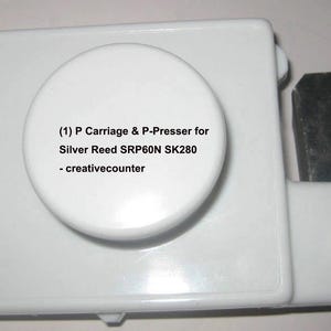 May include: White knitting machine parts, including a carriage and presser labeled "(1) P Carriage & P-Presser for Silver Reed SRP60N SK280 - creativecounter." Also shown are a D-Slider and end stitch supporters.