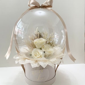 Bubble  bouquet   In Bobo balloon with silk and dried flowers. Beautiful gift for any occasion. Personalised with any message