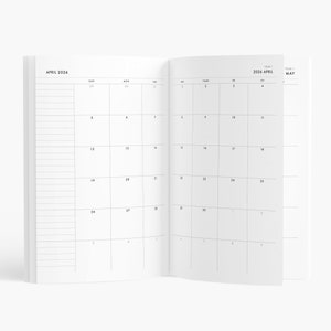 May include: Open planner showing the April 2026 calendar. The left page has lined sections, while the right page displays the days of the month. The calendar is in black and white, with the month and year clearly labeled.