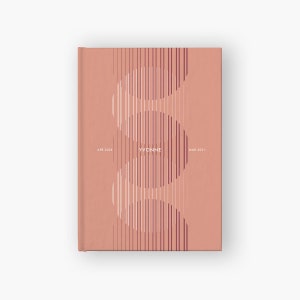 May include: A hardcover journal with a salmon-colored cover. The cover features a vertical design of curved lines in white and burgundy, with the name "YVONNE" in the center. The dates "APR 2026" and "MAR 2031" are also printed on the cover.