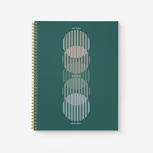 May include: A teal green spiral bound notebook with a gold coil. The cover features a design of three overlapping circles with vertical lines in shades of green, pink, and white. The text "APR 2026" is at the top, "ALICIA" is in the center, and "MAR 2031" is at the bottom.